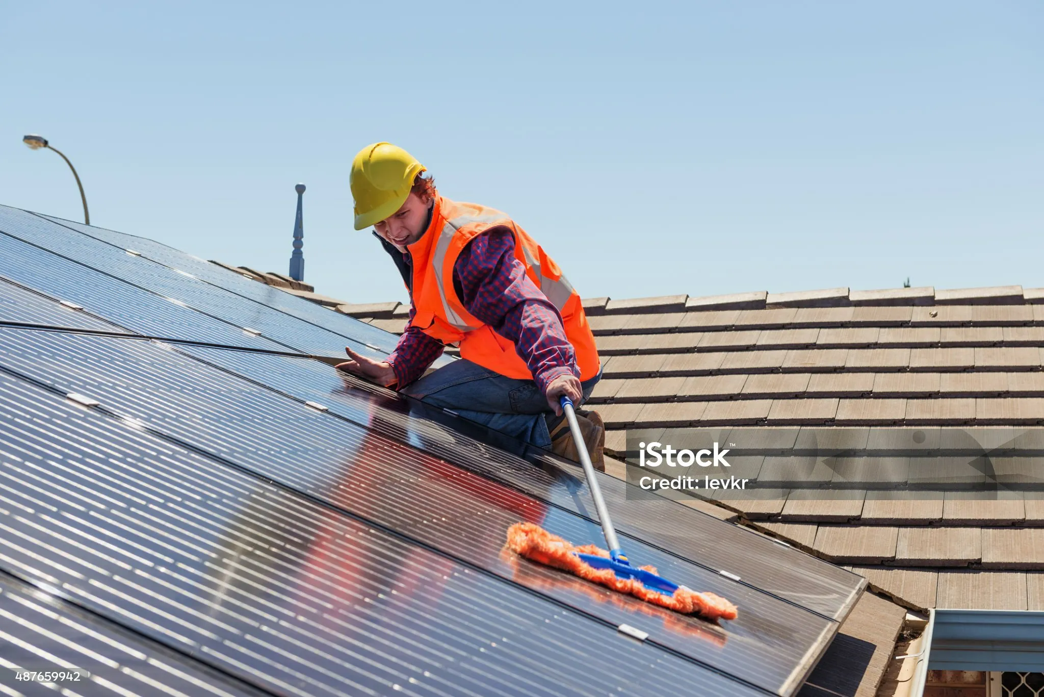 Cleaning team working on solar panels